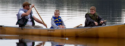 Father and sons canoeing